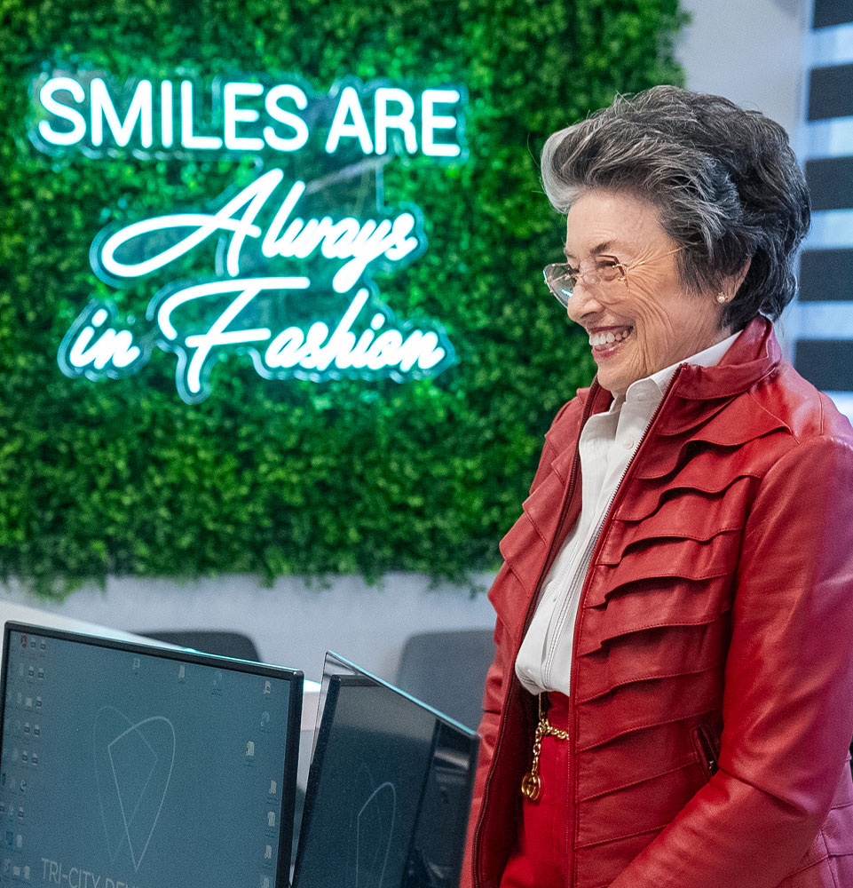 lady with red jacket at front