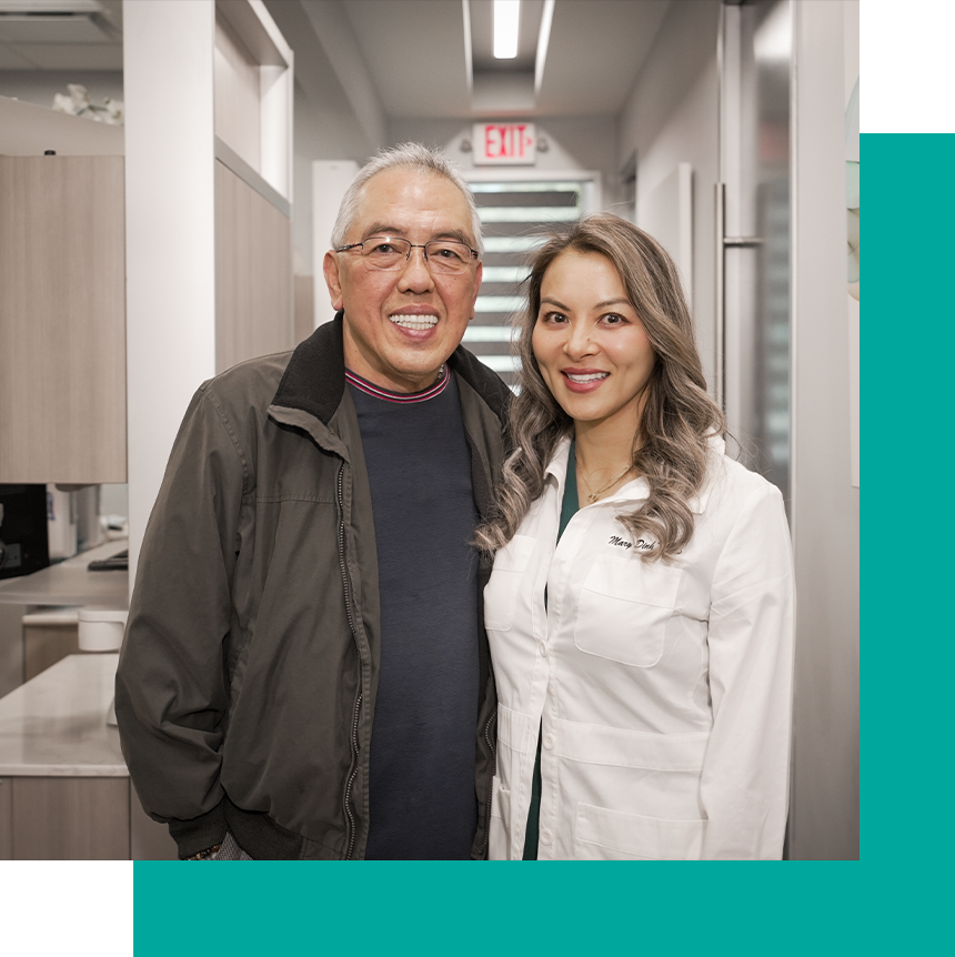 Dr. Dingh and patient smiling in the office