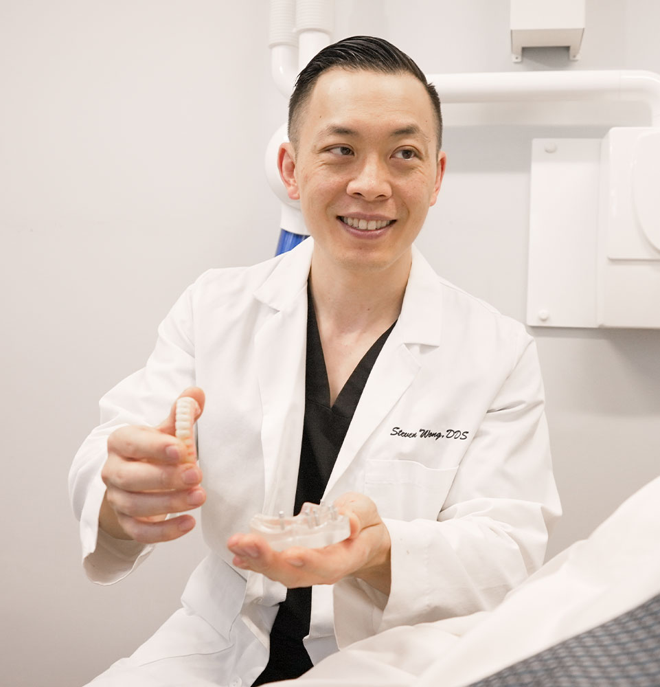 dr wong showing dental implant